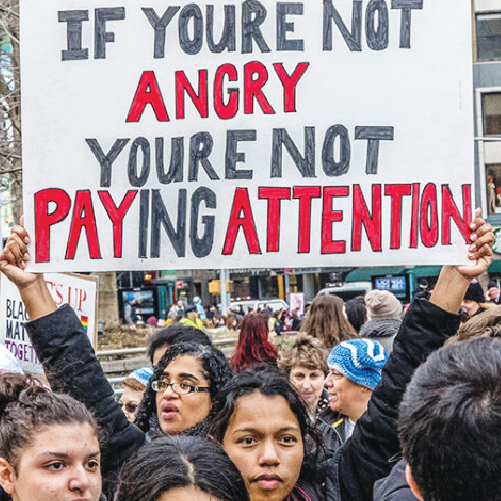 A group of people holding a sign

Description automatically generated