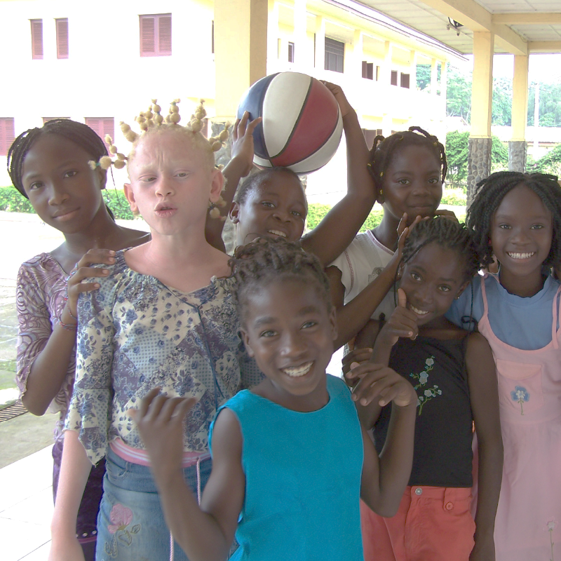 A group of children posing for a photo
Description automatically generated